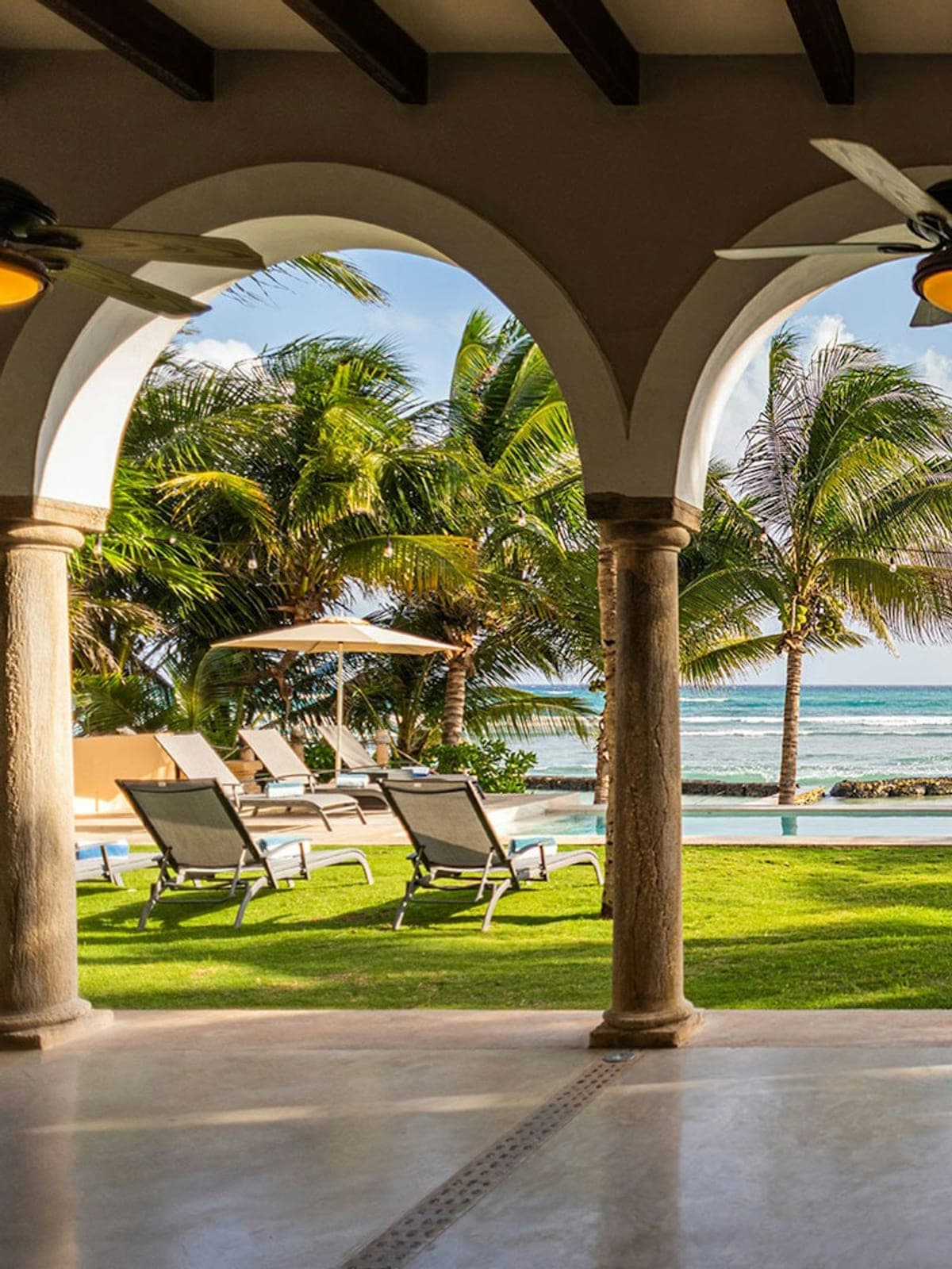 Hacienda del Mar, an oceanfront villa in Puerto Aventuras, Riviera Maya: an arched terrace open to the Caribbean.